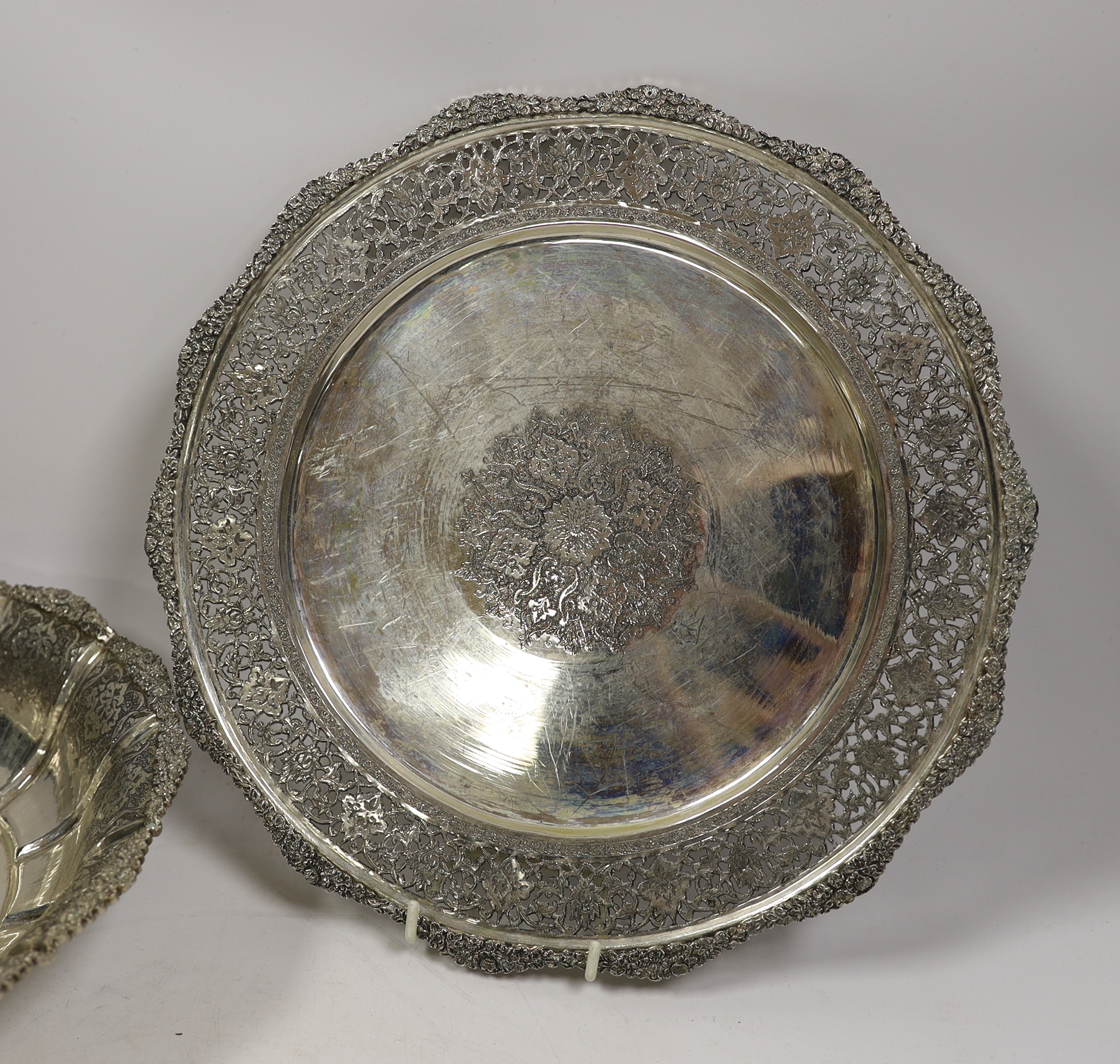 A Persian engraved white metal (stamped 84) fruit bowl, diameter 23cm and a similar pierced dish, 34.4oz.